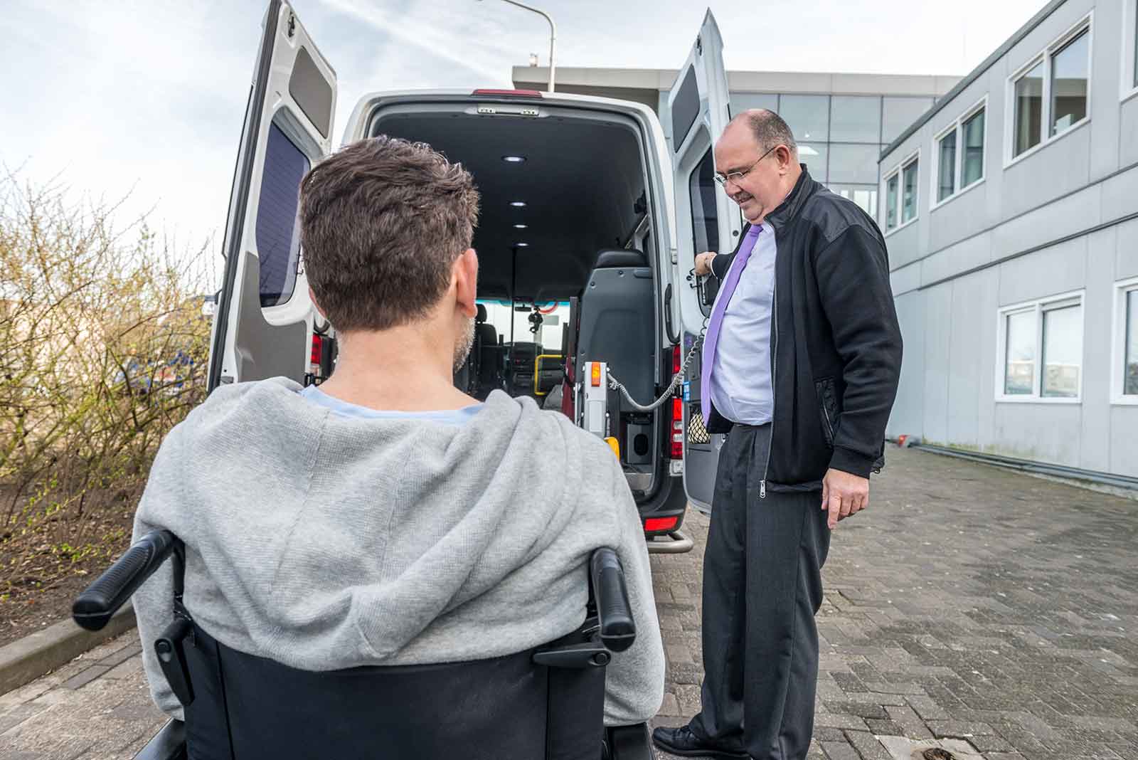 Man in wheelchair entering wheelchair accessible van.